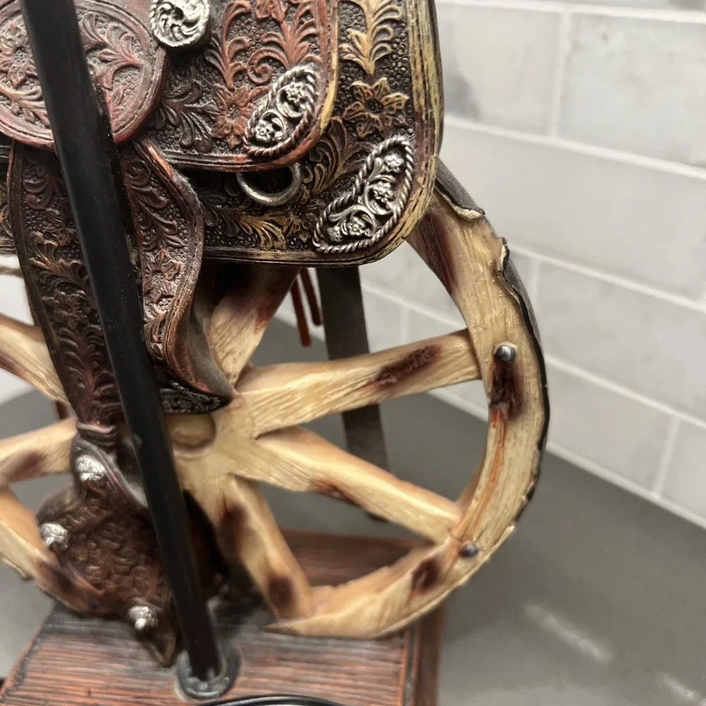 Western vintage Saddle Lamp rope on the saddle, sitting on a wheel/NO LAMP SHADE